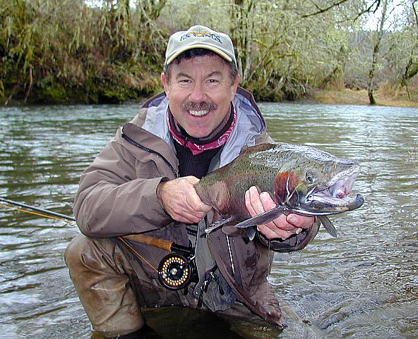 Michael G with smiling Alsea steelhead / trout and steelhead fly fishing / McKenzie River fly fishing guide